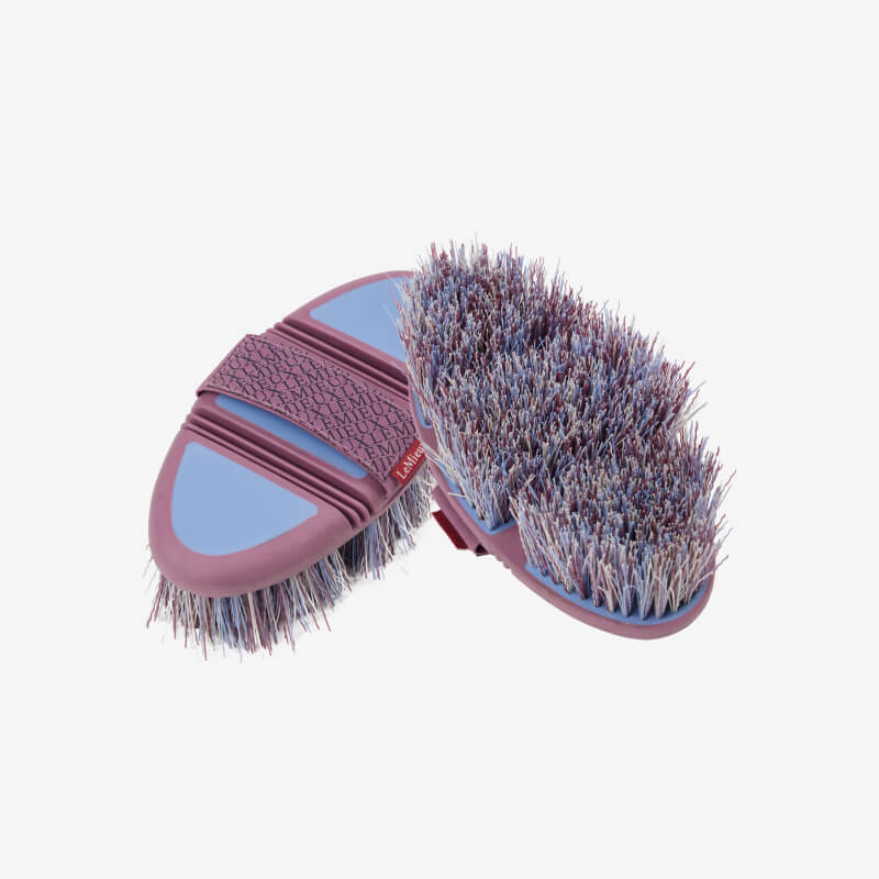 Two LeMieux Flexi Flicky Brushes in powder blue with elastic straps and flicky purple bristles.