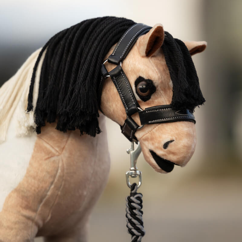LeMieux Toy Pony Leather Headcollar &amp; Leadrope Black—plush horse with black yarn mane and tack.