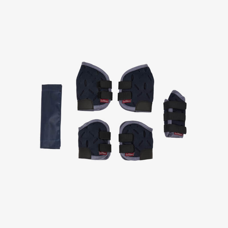 Four navy pads & a wrist guard from the LeMieux Toy Pony Travel Set Navy, perfect for play.