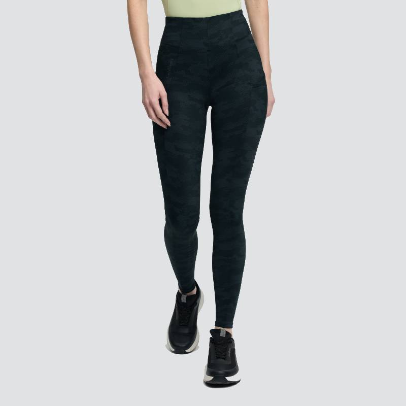 LeMieux Naomi Camo Black pull-on breeches, ankle-length, paired with a green top.