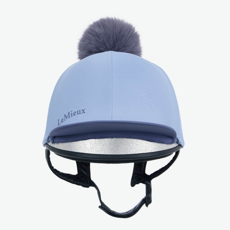 LeMieux Classique Pom Hat Silk in Powder Blue with fluffy pom and chin strap for helmets.