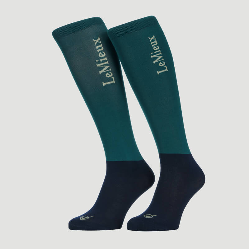 Two LeMieux Competition Socks Jungle 2pk in teal and navy with side text.