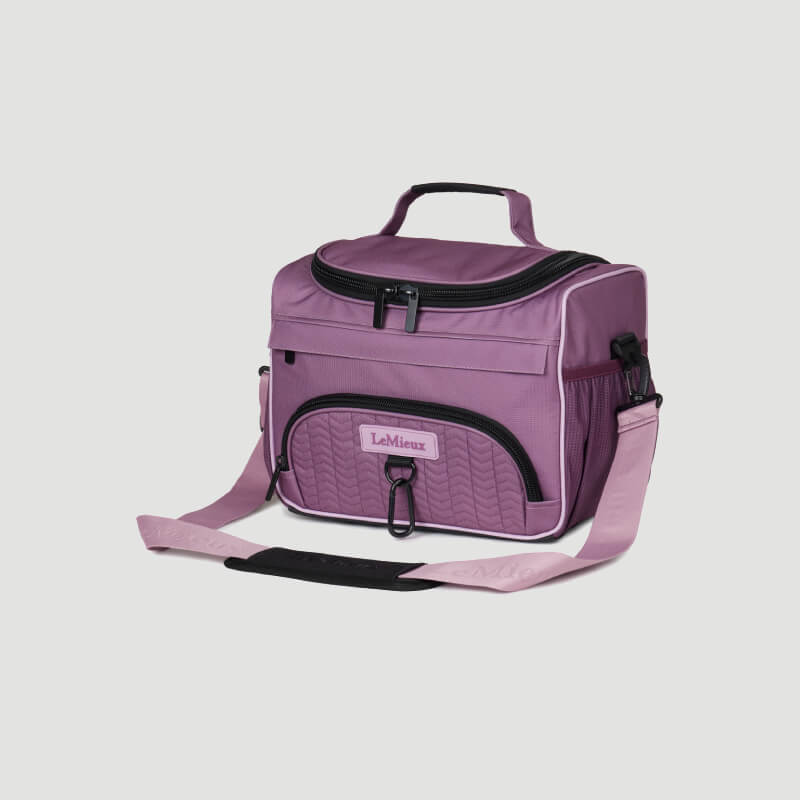 LeMieux ProKit Lite Mallow: lightweight purple bag with handle, front pocket &amp; shoulder strap.