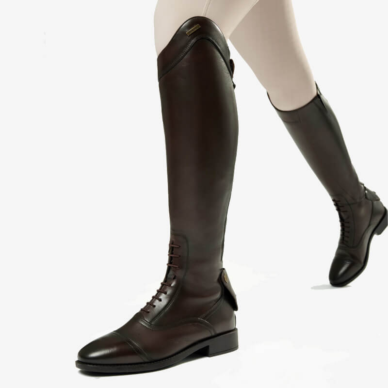 Person wearing LeMieux Field Riding Boot Brown and light-colored riding pants.