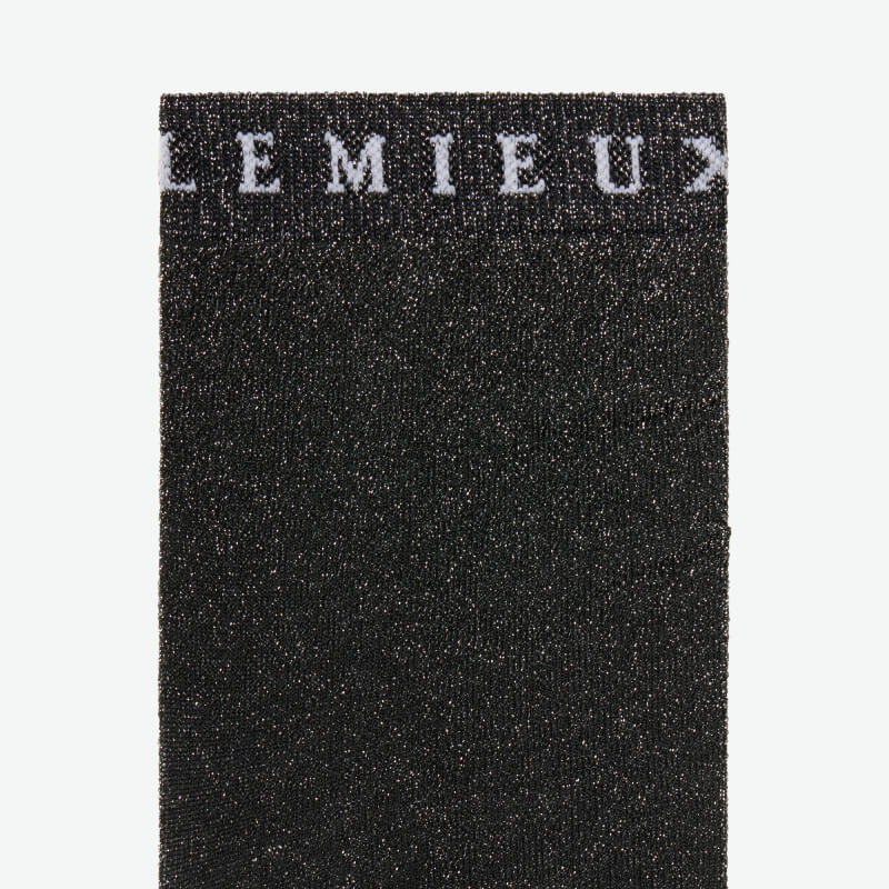 Close-up of LeMieux Brilliance Competition Sock Black with white LEMIEUX text at the top.