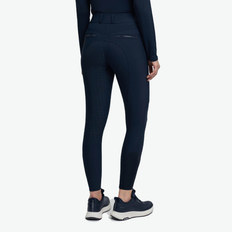 Person wearing LeMieux Brilliance Full Seat Breeches Navy, shown from the back on white.