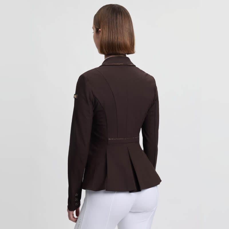 Woman in LeMieux Brilliance Diana Show Jacket Espresso, facing away.