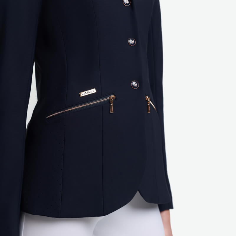 LeMieux Brilliance Junior Pro Show Jacket Navy, styled with white pants.