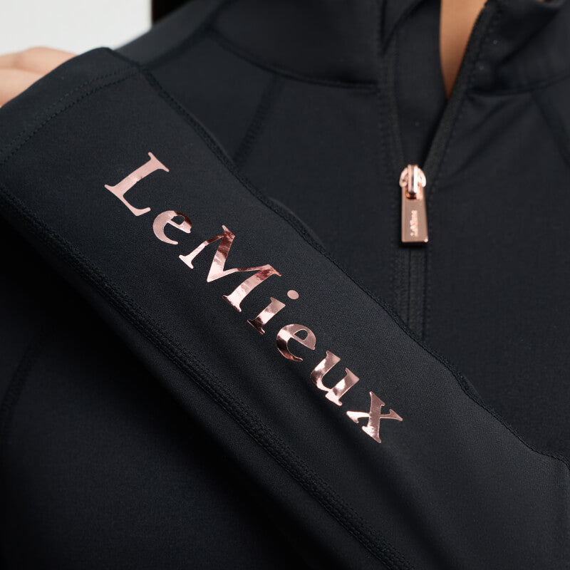 LeMieux Young Rider Sparkle Baselayer Black with shiny sleeve lettering and zip-up collar.