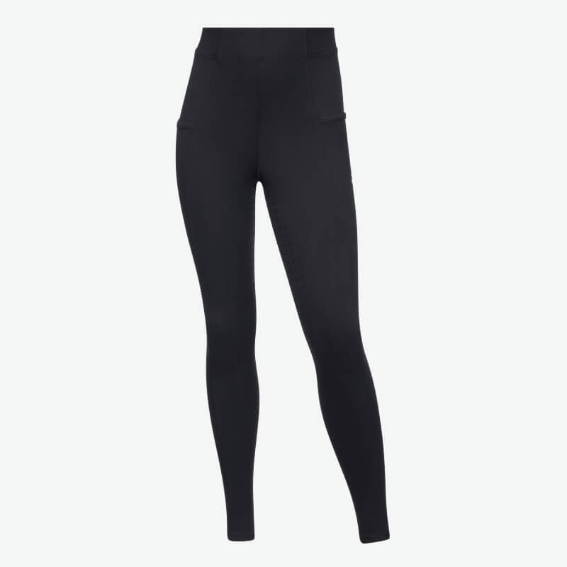 Young rider wears LeMieux Young Rider Sparkle Orla Pull On Black tights, black top, and sneakers.