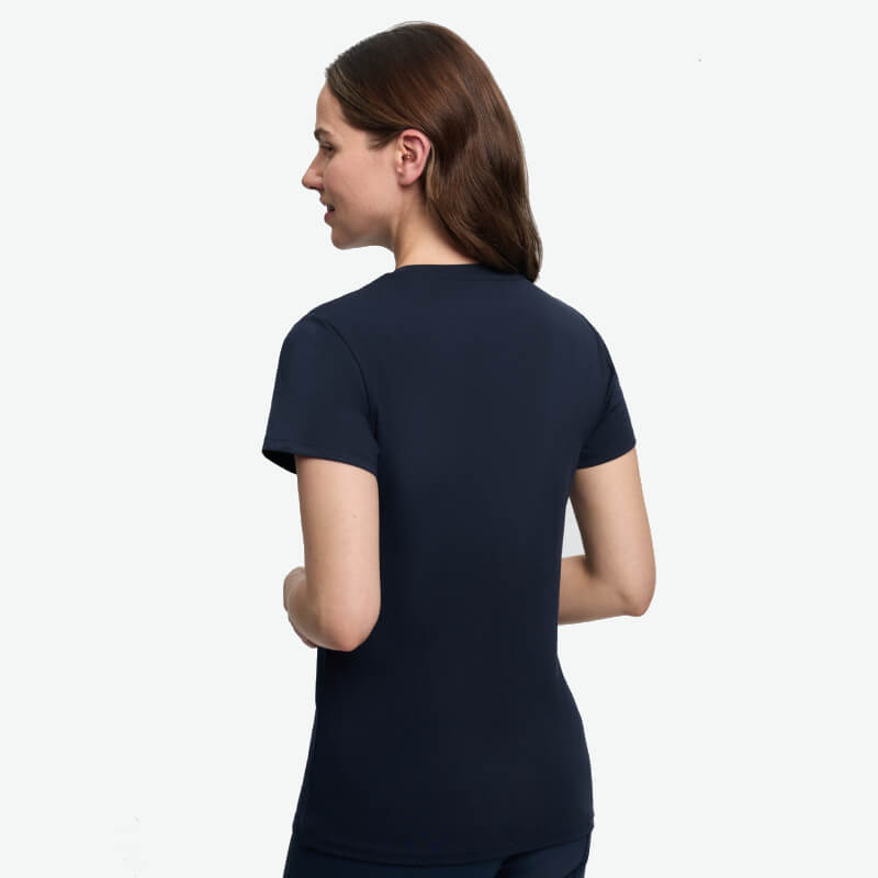 Woman with brown hair in a navy LeMieux Brilliance T-Shirt, back view on white background.
