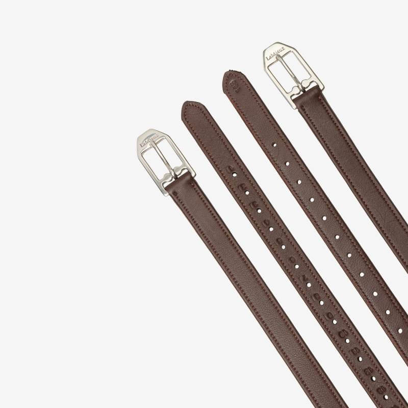 Three LeMieux Arika Stirrup Leather Havana straps with silver buckles arranged diagonally on white.