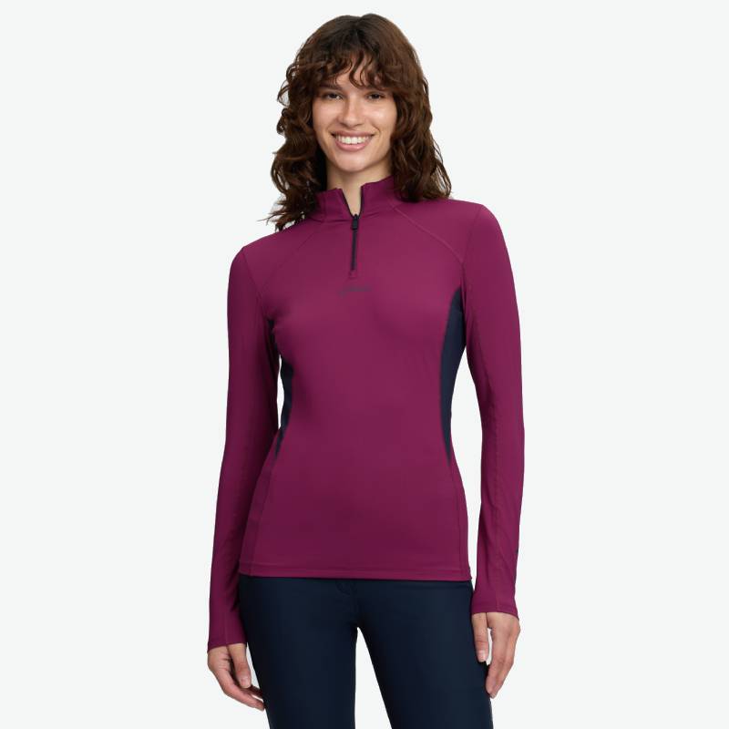 Smiling person in a LeMieux Classique Baselayer Blackberry and dark pants on white background.