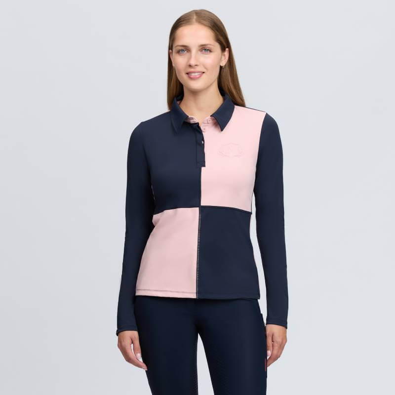 Woman in a LeMieux Harlequin Rugby Shirt Baselayer Petal/Navy for an equestrian chic look.