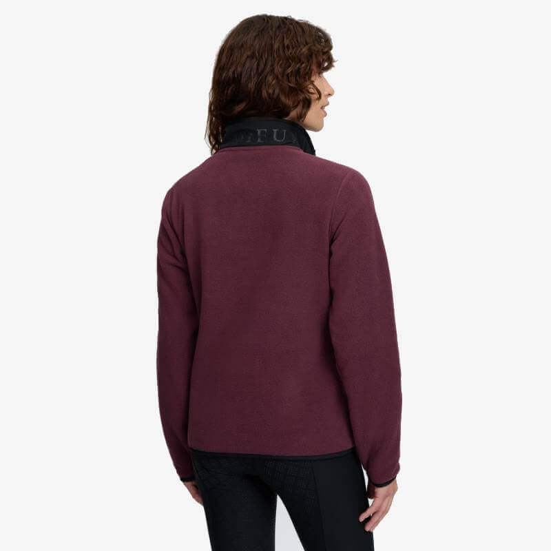 Person wearing LeMieux Piper Popper Fleece Bramble, back turned, on plain white background.
