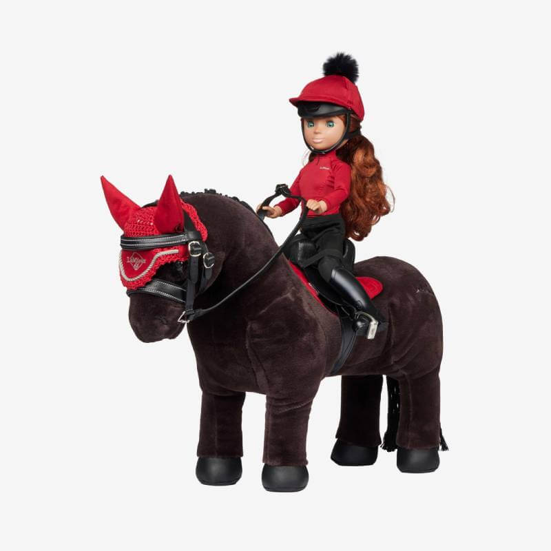 LeMieux Toy Rider sits with Steady Saddle Black for imaginative play on plush brown horse.