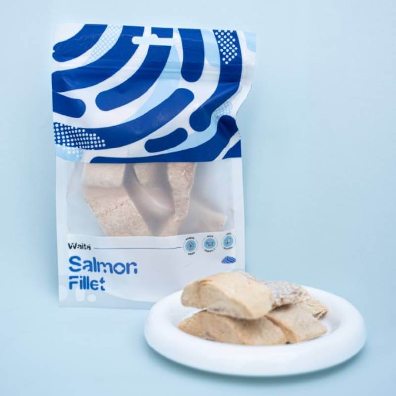 Waita Freeze Dried Salmon Fillet Dog &amp; Cat 40g pack and pieces on a light blue background.