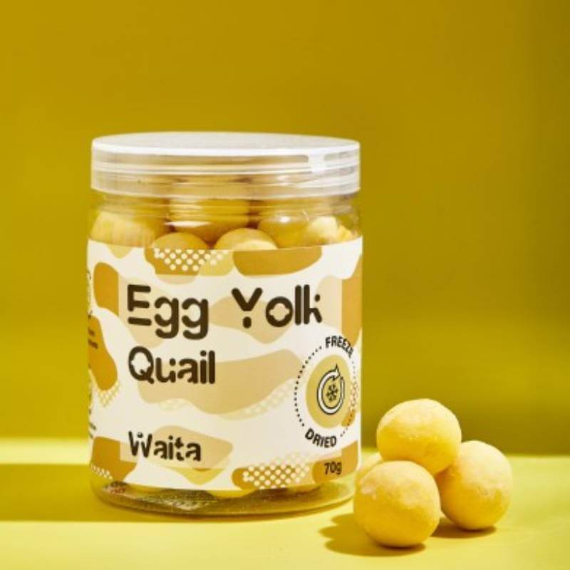 A yellow jar labeled Waita with freeze dried quail egg yolk balls for dogs &amp; cats, 70g tub.