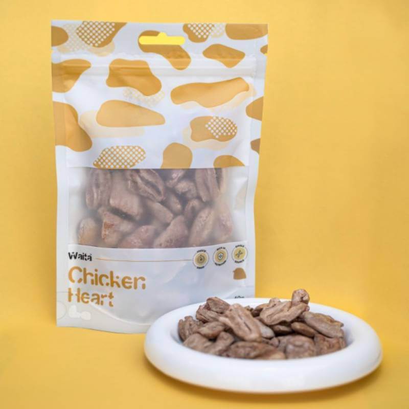 Waita Freeze Dried Chicken Heart Dog &amp; Cat 40g bag and plate of high protein treats on yellow.