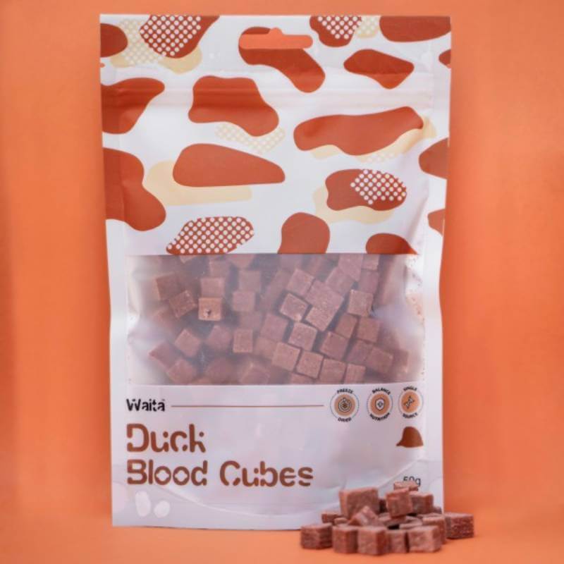 Waita Freeze Dried Duck Blood Dog &amp; Cat 50g with cubes shown on an orange background.
