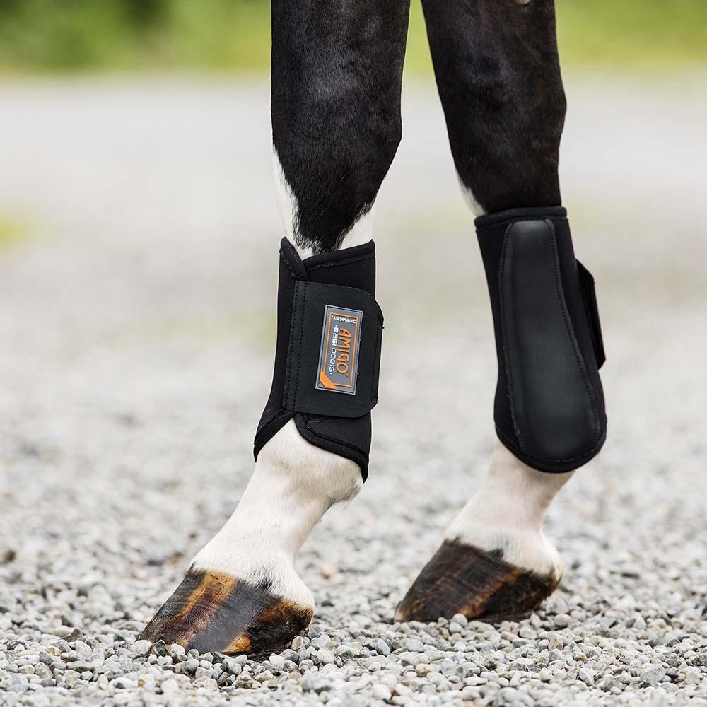 Close-up of a horse’s lower legs in Horseware Amigo Easiboots with a quick closure system.