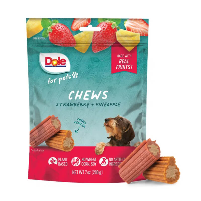 Dole Dog Chews Assorted Strawberry &amp; Pineapple 200g with a small dog.