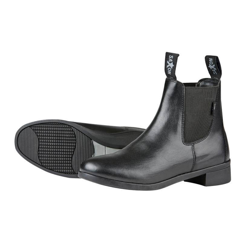 A pair of Saxon Syntovia Jodhpur Boots Adults Black, one upright, one on its side.