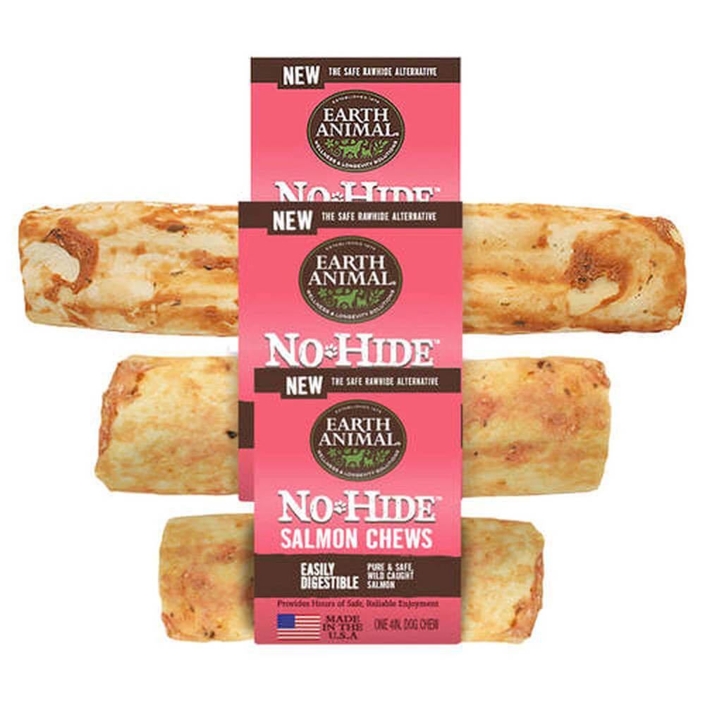 Four Earth Animal No Hide Single Chews stacked; a rawhide alternative for dogs.