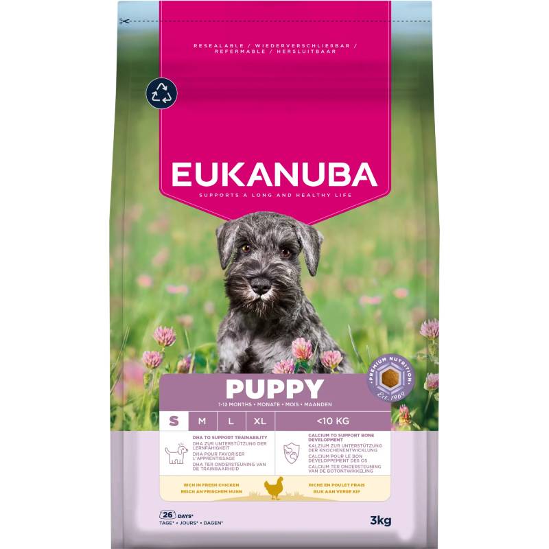 Eukanuba Puppy Small Breed dry food with a gray puppy in a clover field on the bag.