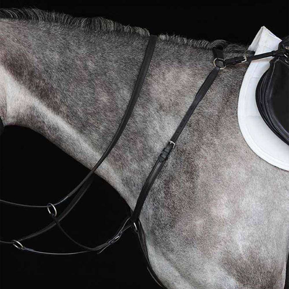 Close-up of a gray horse in a Collegiate Hunter Breastplate by Collegiate and white saddle pad.
