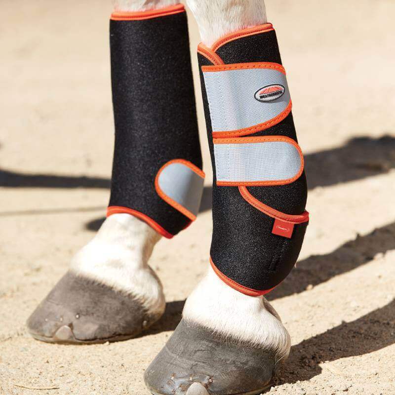 Close-up of a horse’s legs wearing Weatherbeeta Therapy-Tec Stable Boot Wraps Black/Silver/Red.