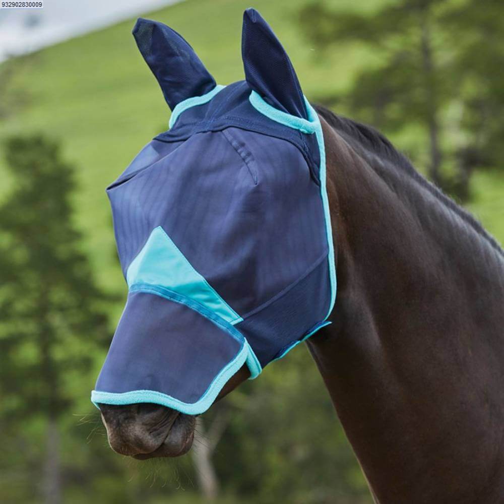 A horse wears a Weatherbeeta Comfitec Fine Mesh Mask With Ear & Nose while outdoors.