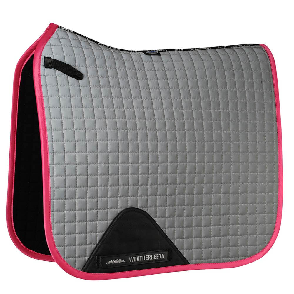 Weatherbeeta Reflective Prime Dressage Saddle Pad in silver/pink with a black corner patch.