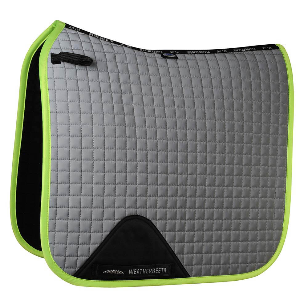 Silver Weatherbeeta Reflective Prime dressage saddle pad with yellow edging.