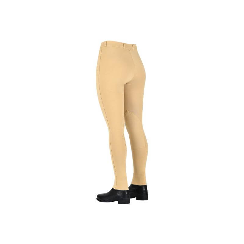 Saxon Warm Up Zip Front Jodhpurs Childs Beige with black boots on a white background.