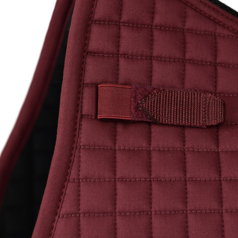 Close-up of quilted burgundy Weatherbeeta Prime Air-Tec all purpose saddle pad fabric.
