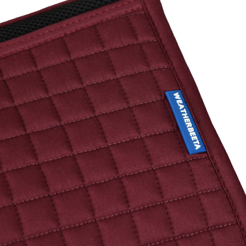 Close-up of the Weatherbeeta Prime Air-Tec All Purpose Saddle Pad in burgundy.