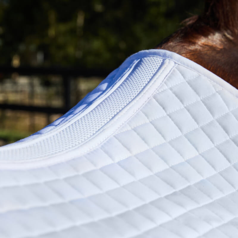 Weatherbeeta Prime Air-Tec Dressage Saddle Pad White shown on a horse's back outdoors.