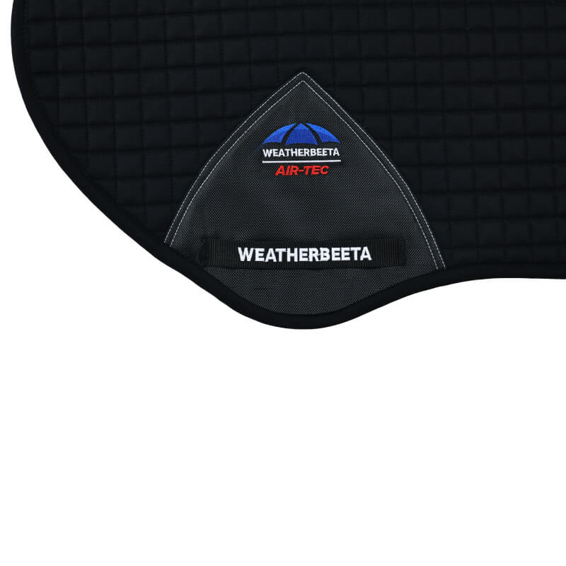 Close-up of the Weatherbeeta Prime Air-Tec Jump Shaped Saddle Pad in black with logo and stitching.