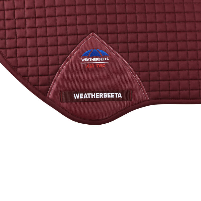 Weatherbeeta Prime Air-Tec Jump Saddle Pad in burgundy with branded label.