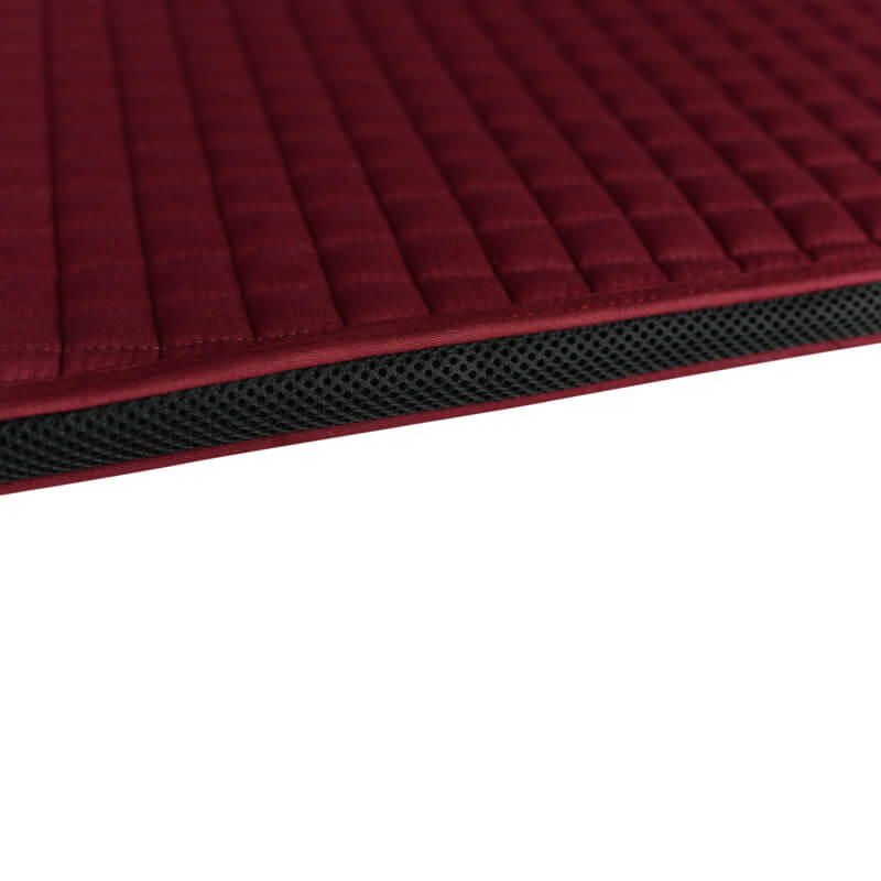 Close-up of Weatherbeeta Prime Air-Tec Jump Saddle Pad in burgundy with black mesh trim.