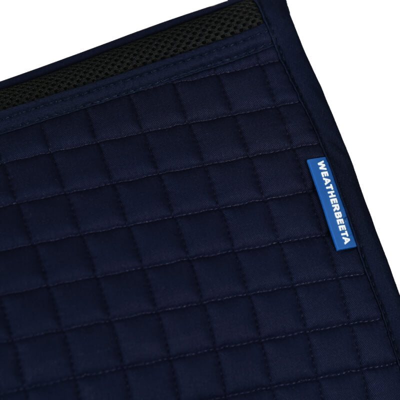 Weatherbeeta Prime Air-Tec Jump Saddle Pad in navy with quilted fabric and black mesh trim.