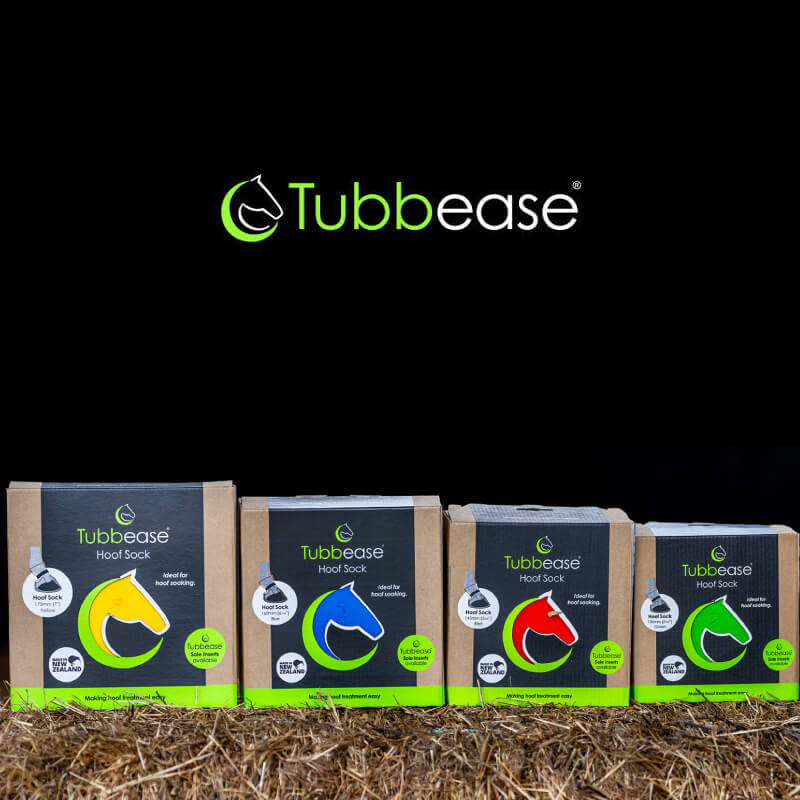 Four Shoof Tubbease Hoof Sock boxes for hoof care shown on hay with the Shoof logo above.