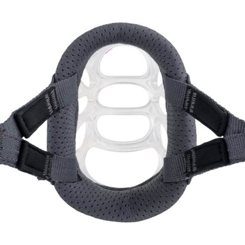 Close-up of a gray Baskerville Invisa Muzzle with clear silicone rings, like a transparent dog muzzle.