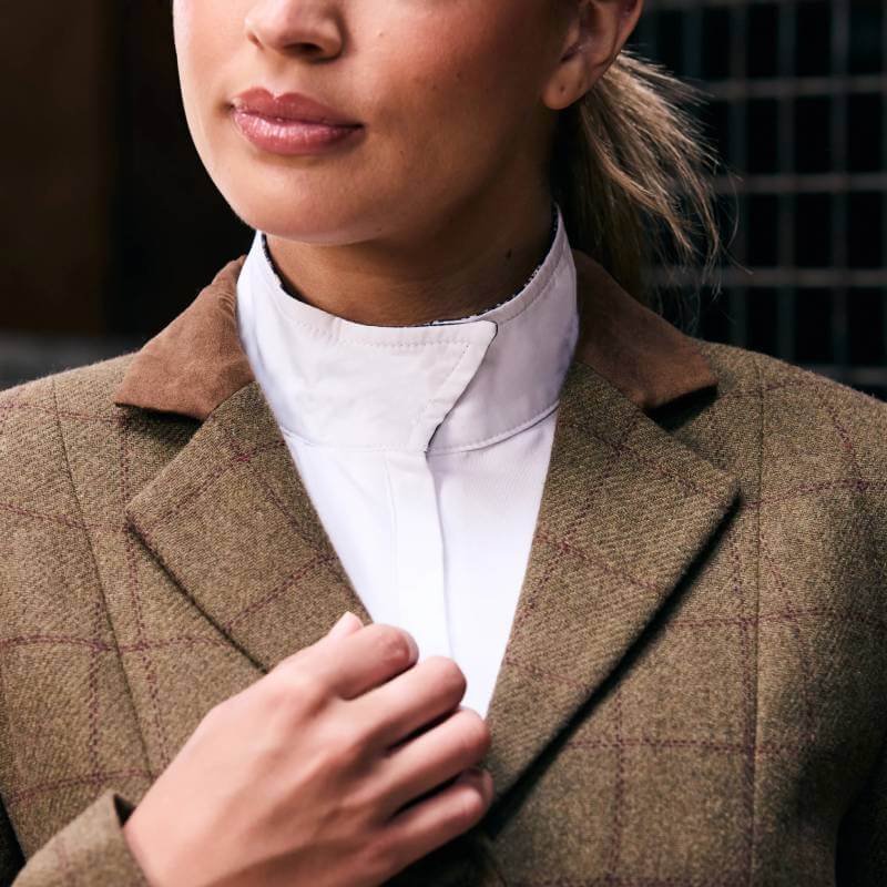 Woman wearing the Dublin Albany Tweed Suede Collar Tailored Jacket, adjusting her collar.