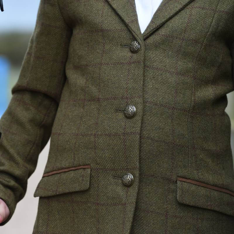 Child wearing Dublin Albany brown tweed tailored jacket with suede collar and flap pockets.