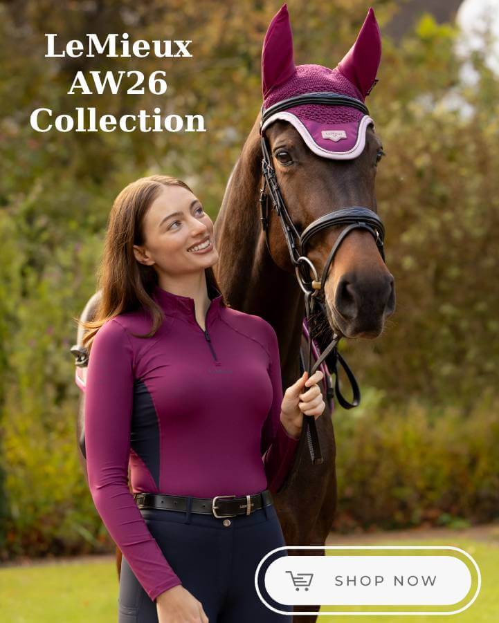 A woman in a purple equestrian quarter-zip shirt stands beside a brown horse wearing a matching purple fly veil and bridle, with the text 'LeMieux AW26 Collection' and a 'SHOP NOW' button on a blurred outdoor background.