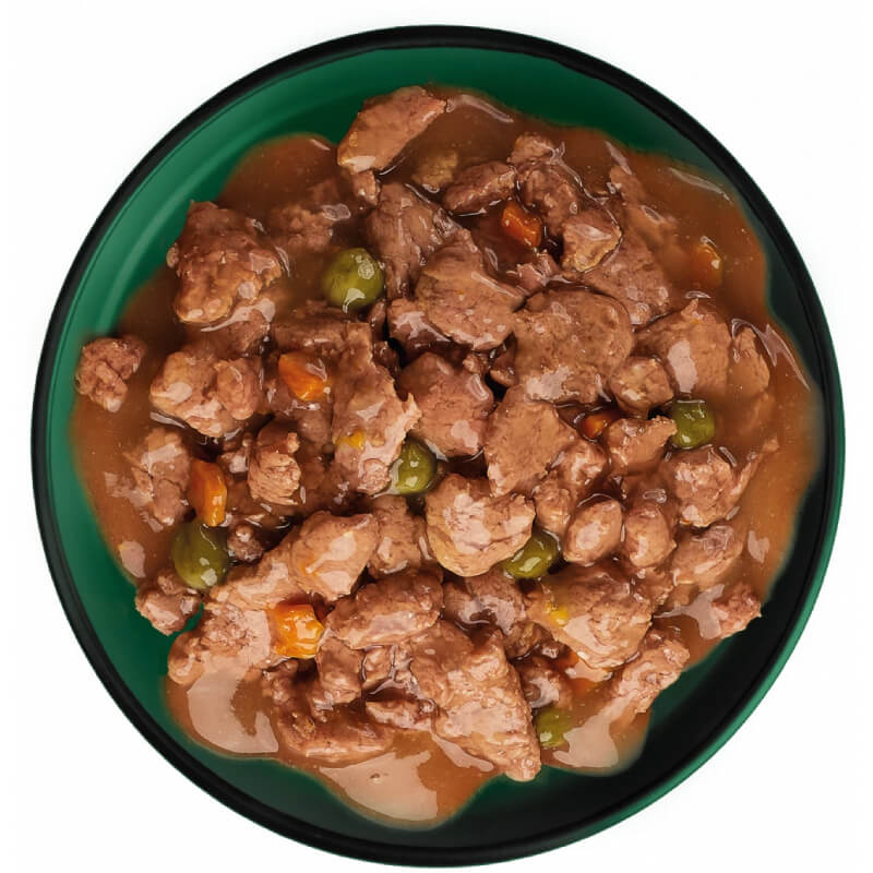 Meaty chunks in gravy with peas and carrots, like Natures Menu Bites in Gravy Cat Pouch.