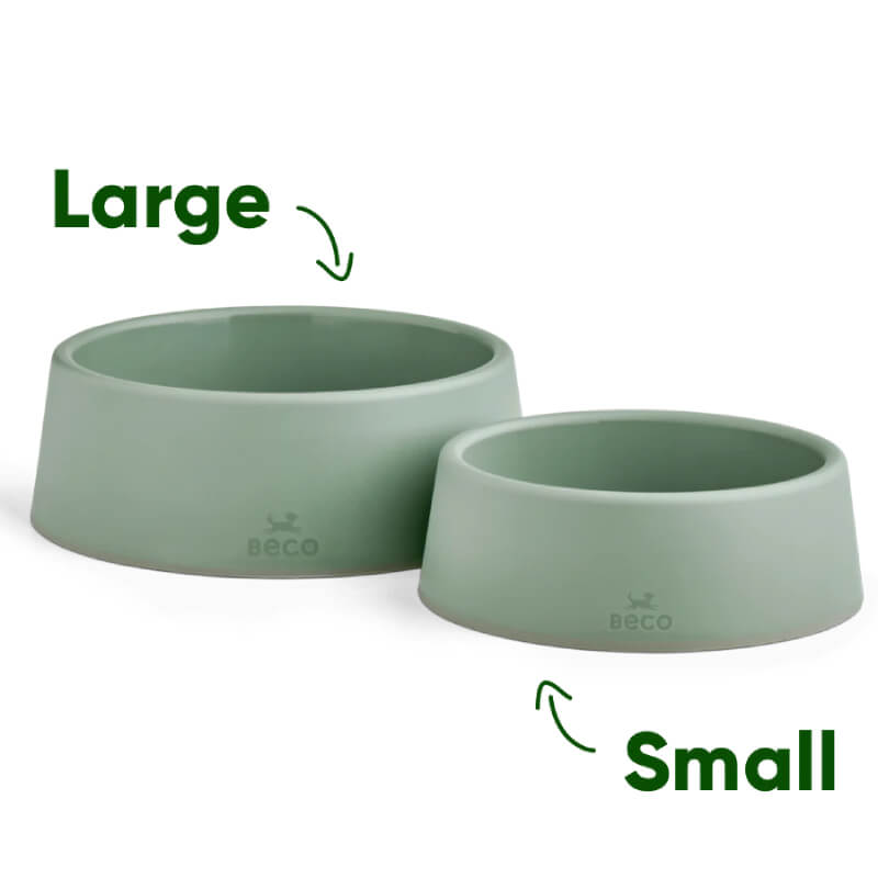 Two Beco Steady Dog Bowls in green, large and small, sit side by side on a white background.